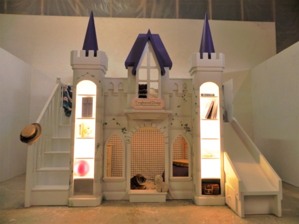 Purple castle bunk bed with hand painting, slide, staircase, and lights.