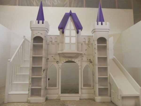 Purple castle bunk bed with slide and staircase.