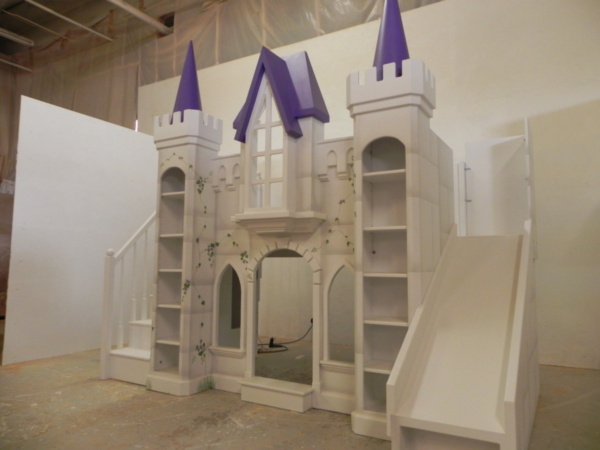 Purple castle bunk bed with straight slide.